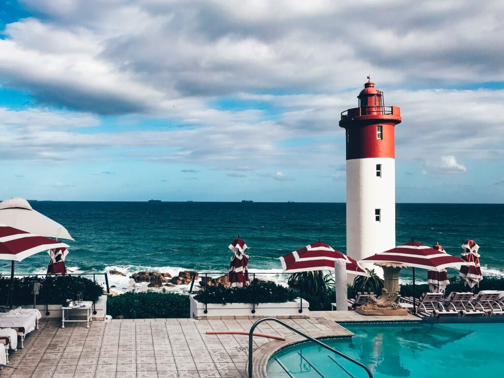 Poolside view with the famous beachfront lighthouse