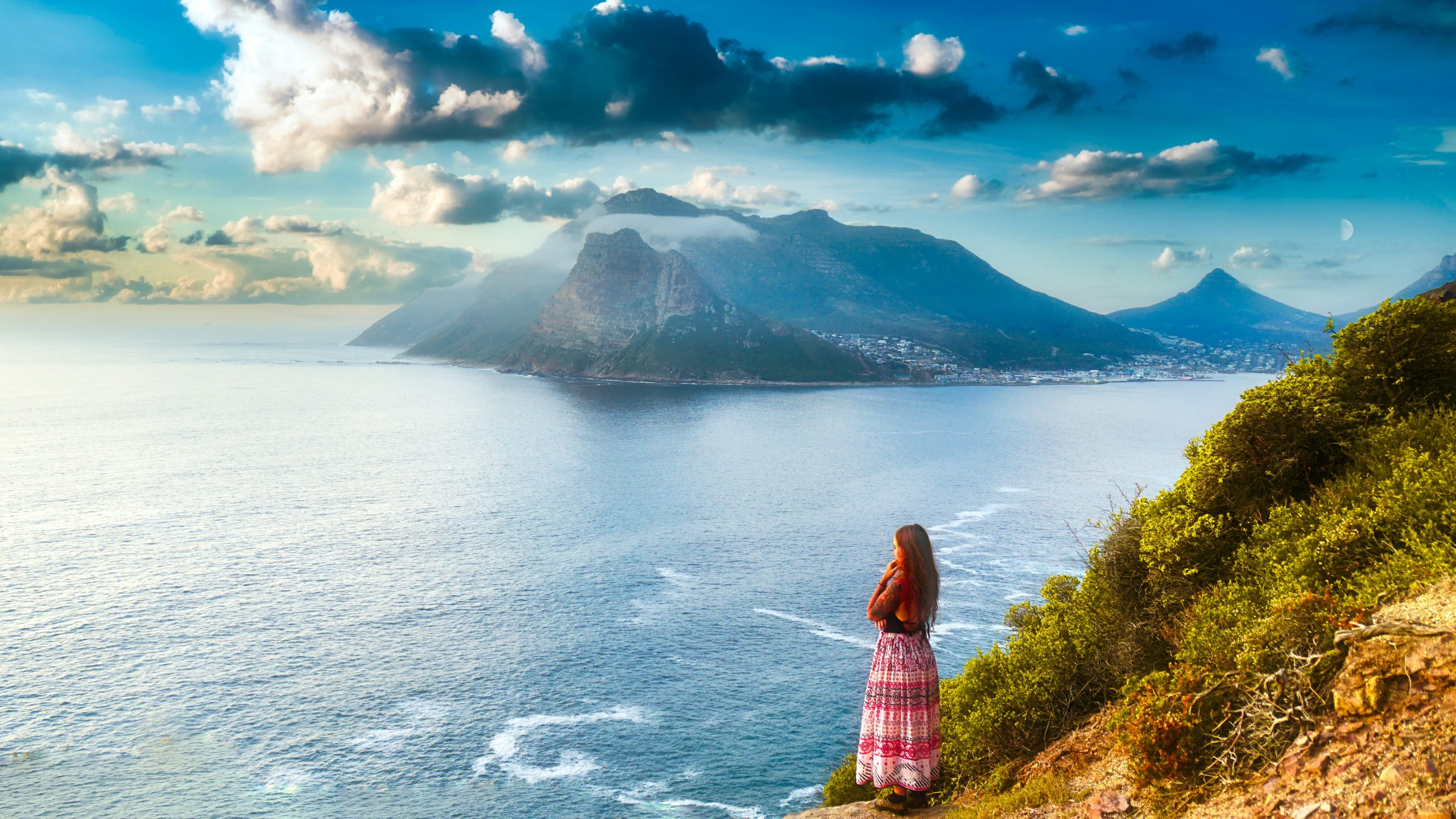 A women admiring the view from Chapmans Peak Drive]