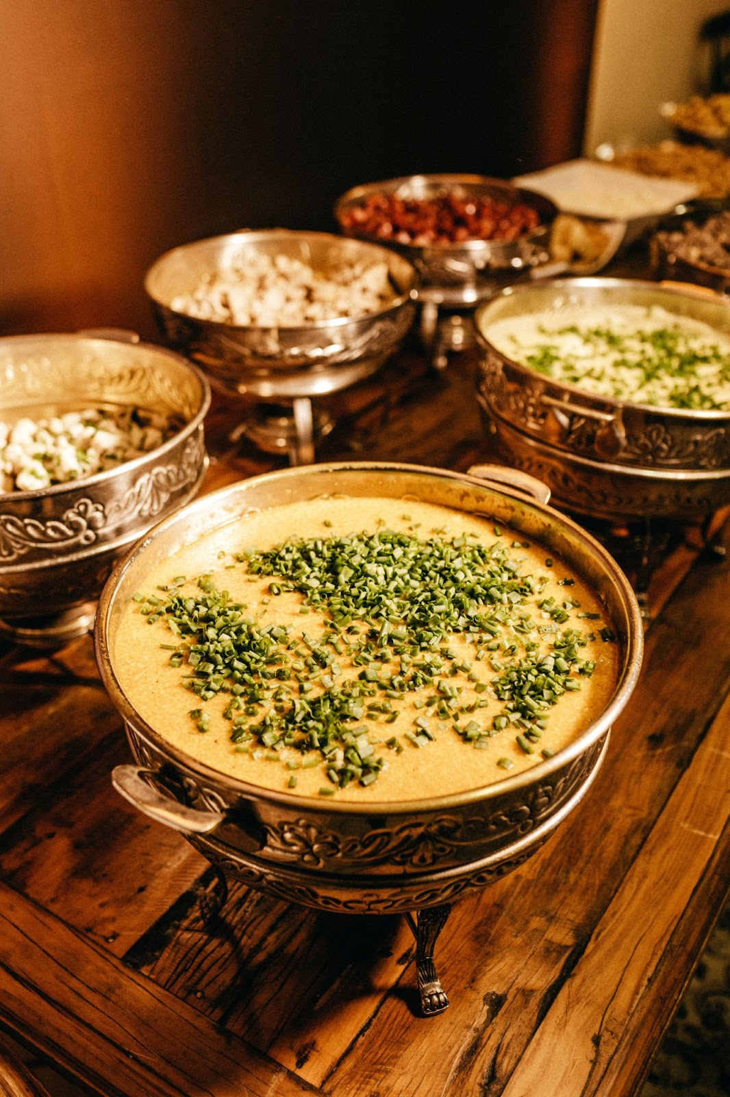A variety of curries displayed in beautiful traditional serving dishes